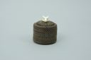 Image of small white-on-black baleen basket with ivory ram's head finial;